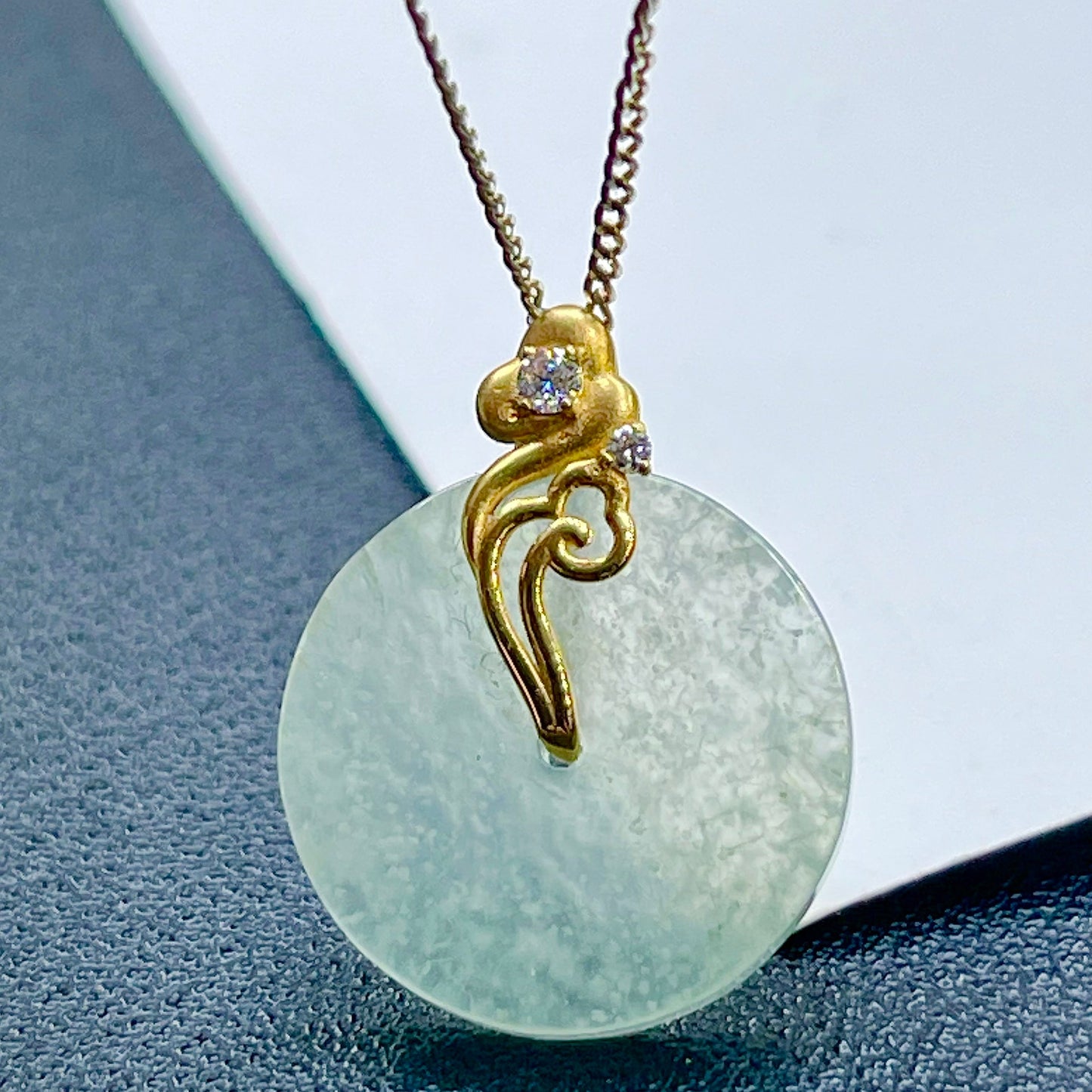 Ice-type jade Ping An Kou with snowflake inclusions  18K gold with auspicious cloud design, symbolizing peace and smooth life