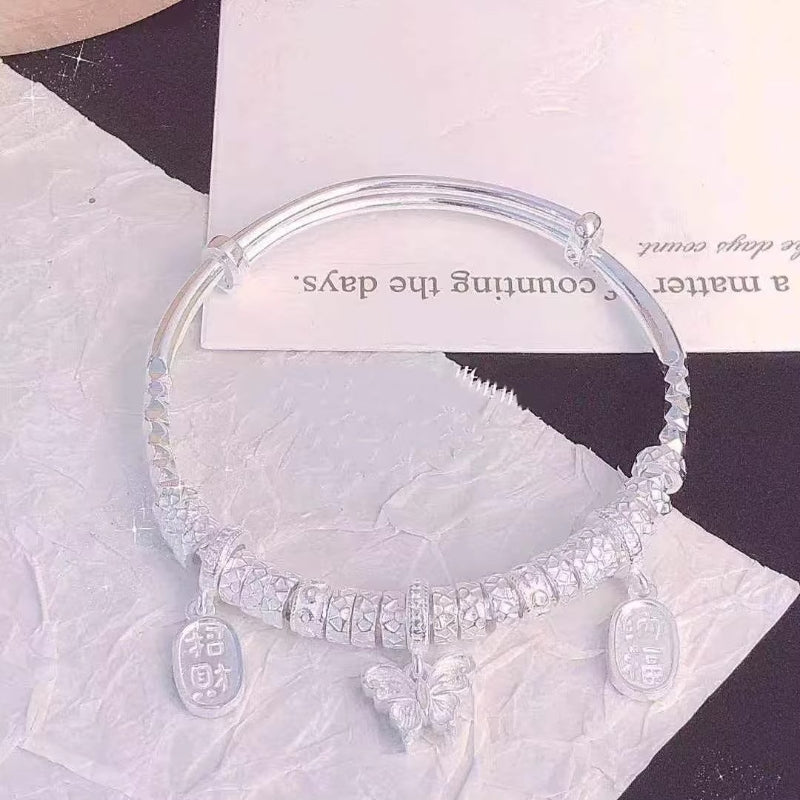 AuraKin Coiled Butterfly Silver Bracelet