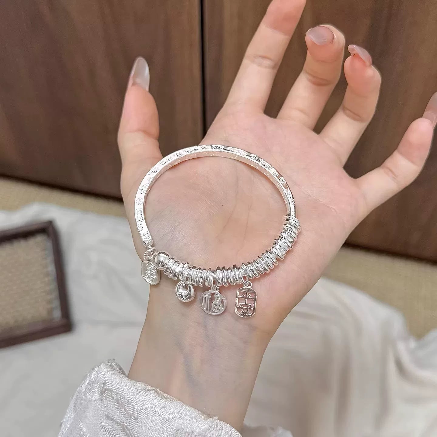AuraKin Coiled Butterfly Silver Bracelet