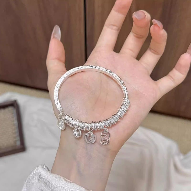 AuraKin Coiled Butterfly Silver Bracelet