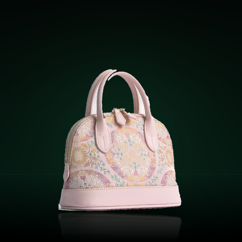 Song Jin silk shell bag on a dark mirror presentation